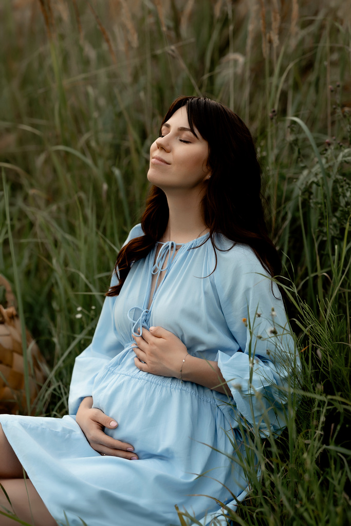 Photoshoot of a pregnant woman in the city of Krakow. Photoshoot field.