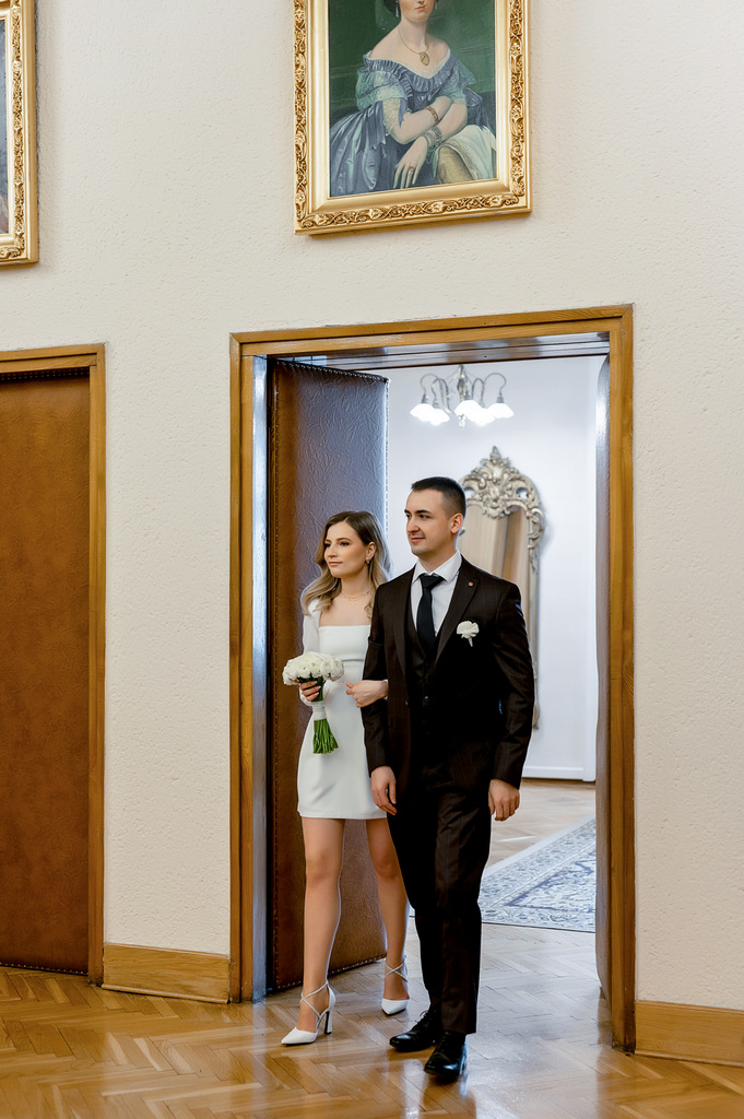 Wedding photo shoot in Krakow. The bride and groom walk through the historical places of the old city of Krakow