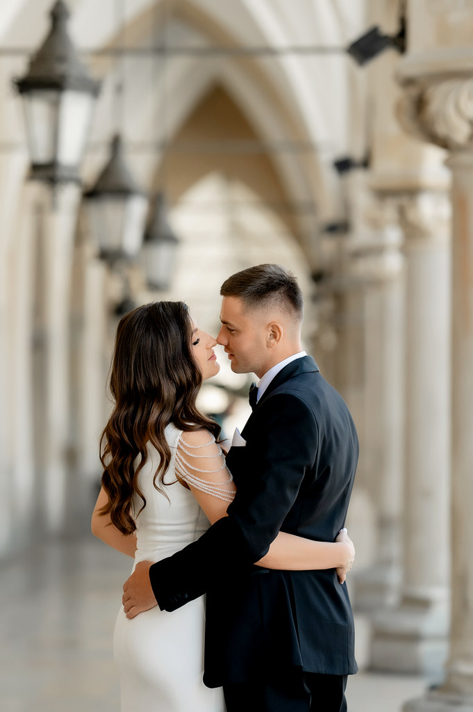 Wedding photoshoot in the old town of Krakow. A girl walks along the streets of the old town in the spring