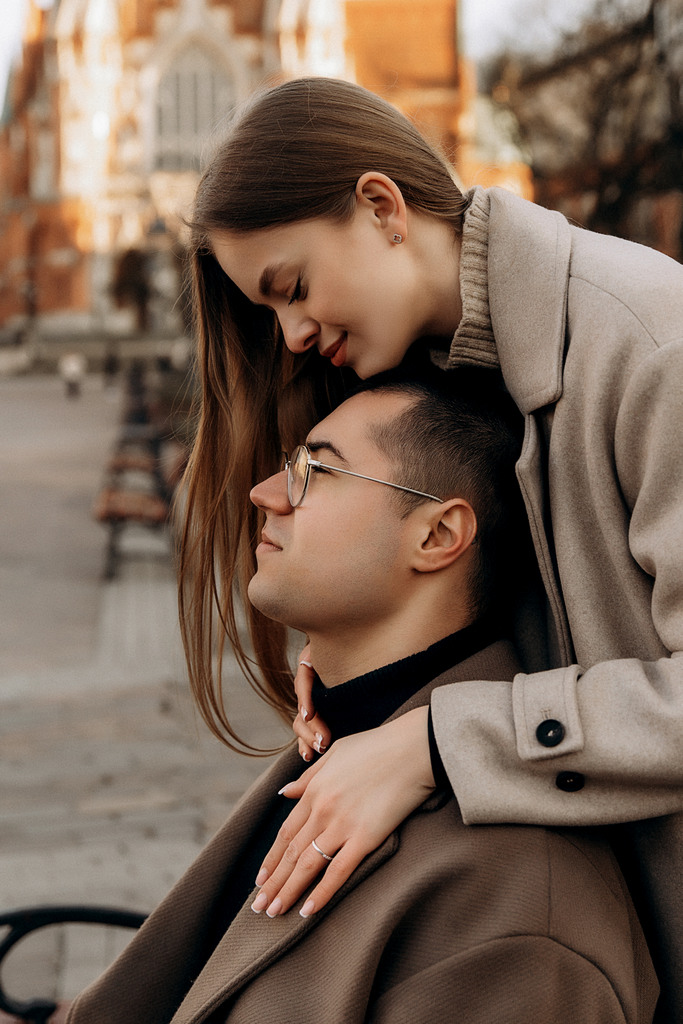 Couple photoshoot in Krakow's old town. A guy and a girl walk along narrow streets and a bridge